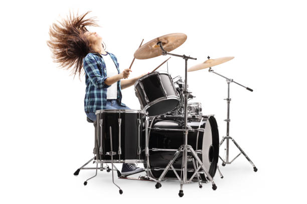 istock Female drummer playing on a drum set and throwing hair back 1197028316