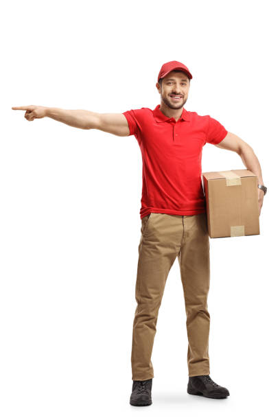 istock Delivery guy with a package box pointing to the side 1197028323