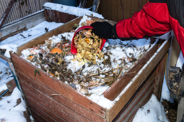 Composting box in winter season with snow stock photo