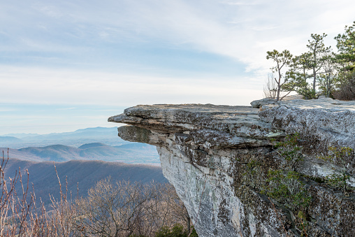 Telephoto overlook of a McAfee Knob and Blue Ridge mountains in Virginia, USA, on sunrise in autumn