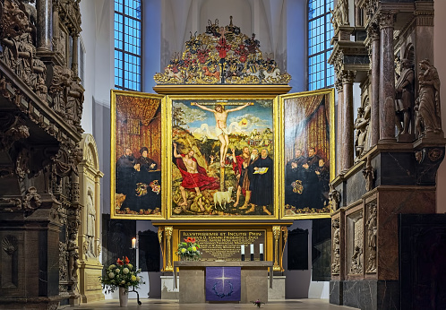 Weimar, Germany - December 12, 2018:  Altar in Sts Peter and Paul Church, also known as Herderkirche (Herder Church). The altar was created in 1552-1555 by Lucas Cranach the Elder and his son Lucas Cranach the Younger.