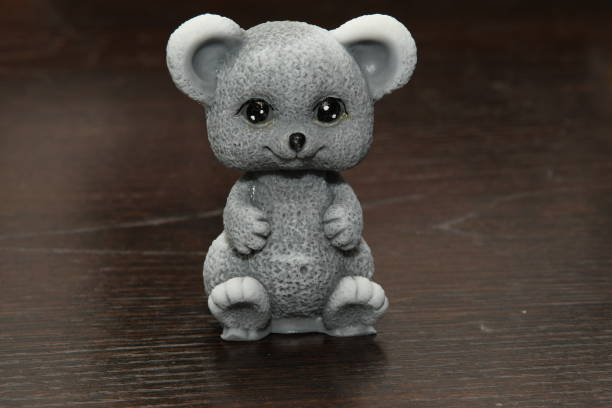 istock mouse figurine on a wooden table 1197040029