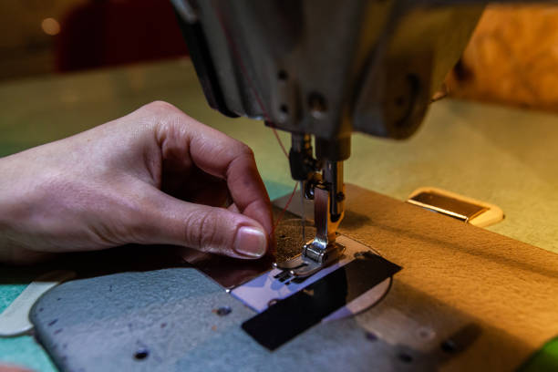 istock Young fashion designer on sewing machine 1197049091