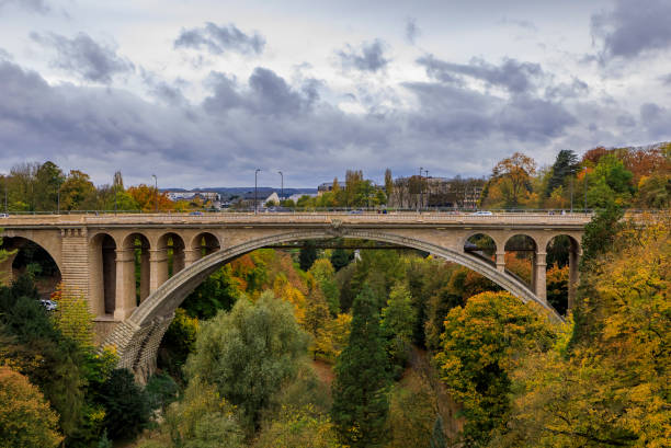 Aerial view of the Adolphe or New Bridge in the UNESCO World Heritage Site old town of the city of Luxembourg, in fall Aerial view of the Adolphe or New Bridge across the Petrusse river in the UNESCO World Heritage Site old town of the city of Luxembourg in the fall petrusse stock pictures, royalty-free photos & images