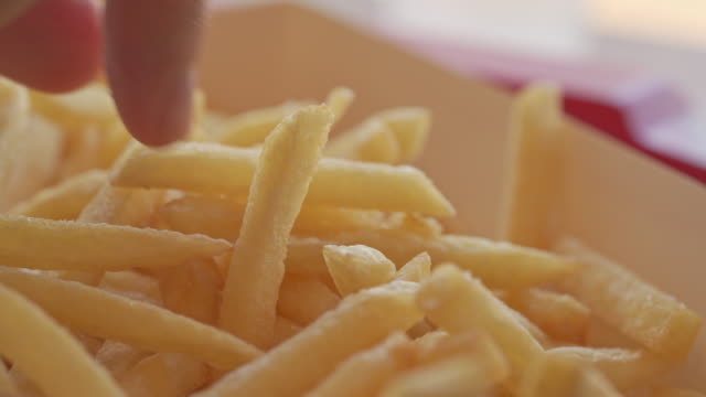 Timelapse of Hand picking French Fries