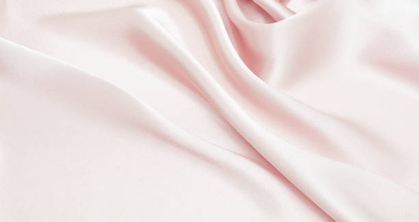 istock Draped satin and silk pink fabric for festive backgrounds 1197054930