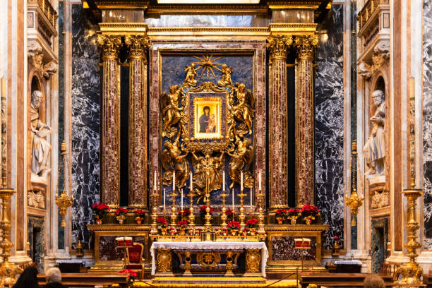 Rome, Italy - December 27, 2019: The Basilica of Saint Mary Major - Santa Maria Maggiore - is a Papal major basilica and the largest Catholic Marian church in Rome. In this photo the altar and the Mater Salus Popoli Romani icon. According to tradition the icon was painted by Luke the evangelist.