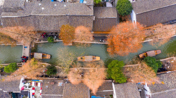 Aerial view Zhujiajiao Water Town and China traditional tourist boats on canals of Shanghai Zhujiajiao Water Town in Shanghai, China. Aerial view Zhujiajiao Water Town and China traditional tourist boats on canals of Shanghai Zhujiajiao Water Town in Shanghai, China. Zhujiajiao stock pictures, royalty-free photos & images