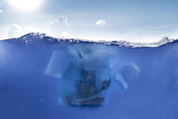 istock plastic package with waste garbage  inside float in the ocean water underwater line, dump environment problem 1197059775