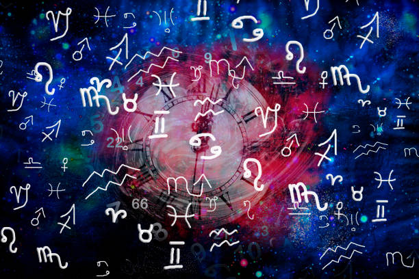 istock Astrological symbols and time on a cosmic blue background 1197061587