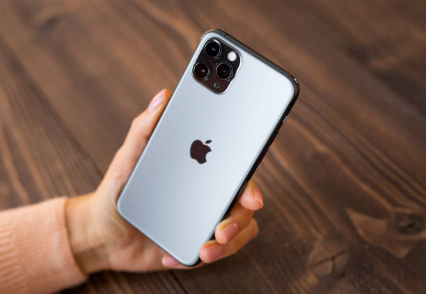 Person holding Apple iPhone 11 Pro stock photo