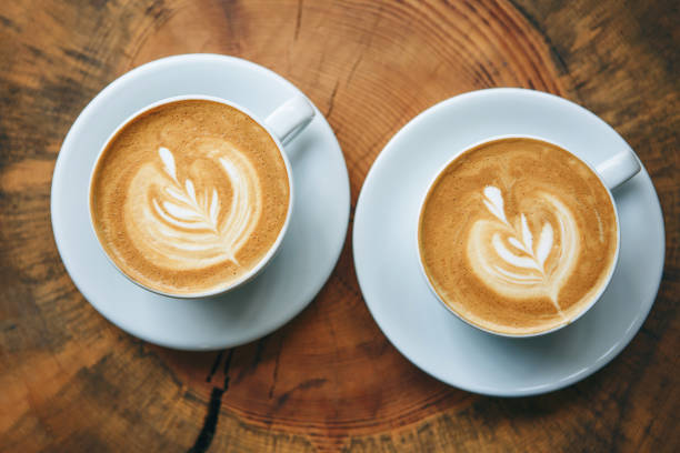 istock Cups of aromatic coffee cappuccino 1197063491