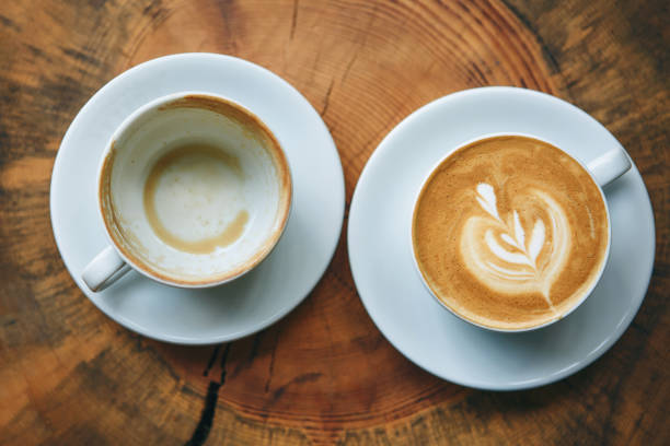 istock Full and empty cup of coffee 1197064222