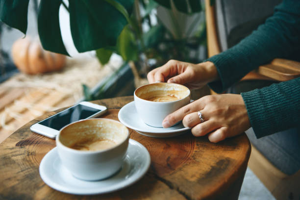 istock Girl drinks coffee during a meeting 1197064231
