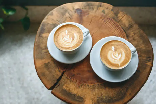 Photo of Cups of aromatic coffee cappuccino