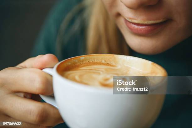Close Up Girl Is Drinking Coffee Stock Photo - Download Image Now - Coffee - Drink, Frothy Drink, Cafe