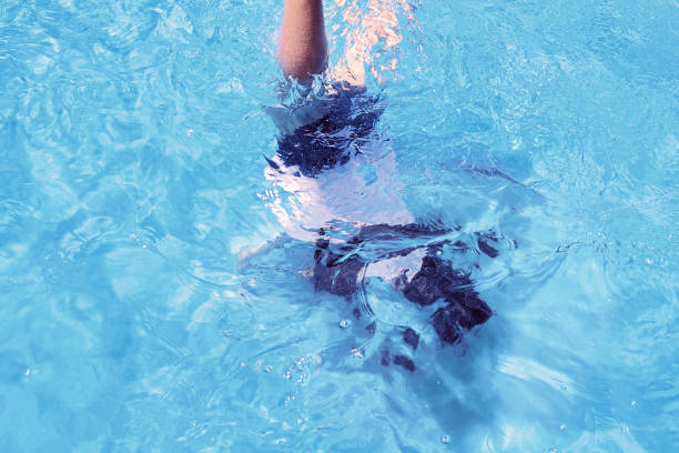 istock Young Girl Swimming Underwater 1197066507