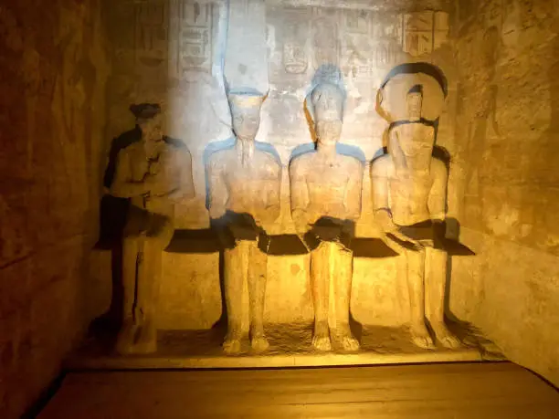 Two times a year the central chamber in Abu Simbel lights up. Then Ramses, Ra en Amun light up, only Ptah, the god of the darkness, remains in the shade