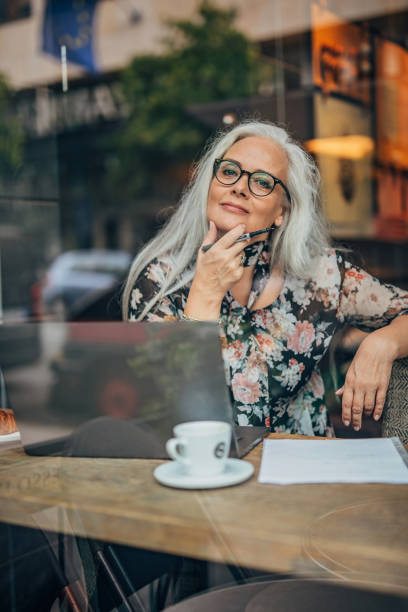 istock Pretty senior woman working on laptop 1197072907