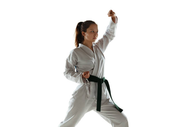 istock Confident junior in kimono practicing hand-to-hand combat, martial arts 1197073160