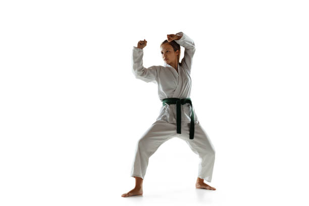 istock Confident junior in kimono practicing hand-to-hand combat, martial arts 1197073214
