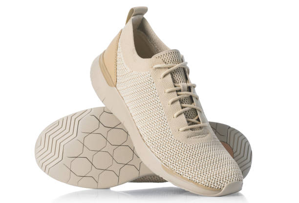 istock Pair of comfortable sneakers isolated on white background 1197073953