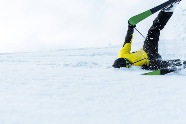 istock sportsman in helmet falling while skiing on slope 1197075542
