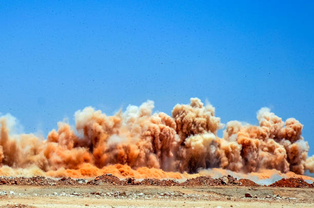 Detonator blasting on the mining site Dust clouds after detonator blast in the desert Oman stock pictures, royalty-free photos & images