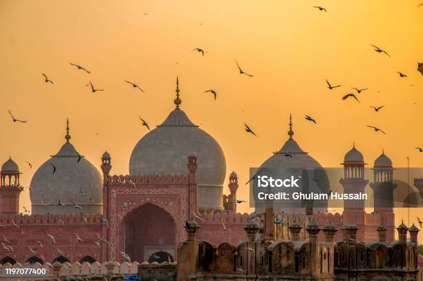 Flying Birds Over The Mosque Stock Photo - Download Image Now - Pakistan, Lahore - Pakistan, Mosque