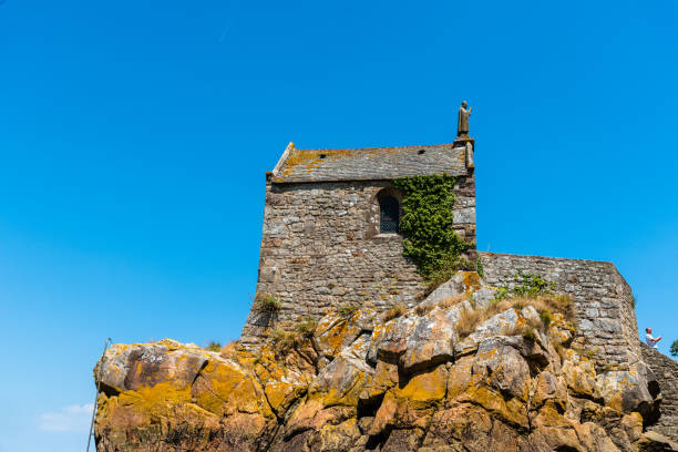 Mont Saint Michel, France - July 25, 2018: View of Hermitage at Mont Saint-Michel against sky