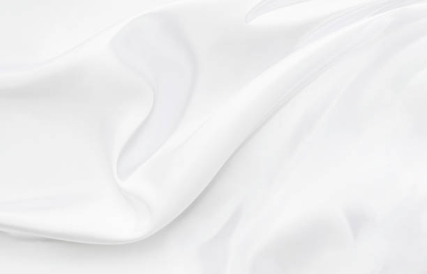 istock White gray satin texture that is white silver fabric silk background with beautiful soft blur pattern natural. 1197078162