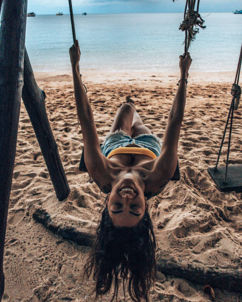 istock Girl having fun on the swing 1197082012