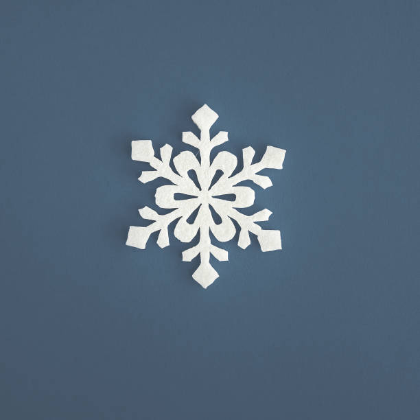 istock Christmas holidays composition, top view white snowflakes decoration on blue-gray background with copy space for text. Flat lay. Winter, postcard template 1197083714