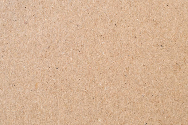 istock Light brown wrapping paper. Natural sheet surface, packaging background. Texture of cardboard, pasteboard, stiff paper. 1197084722