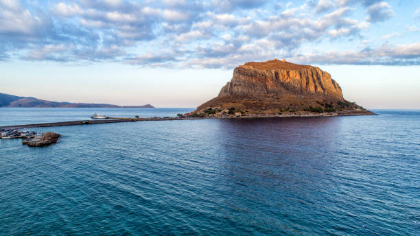 Monemvasia, Greece - 14th April 2017: Unidentified people sitting at cafes and walking in Monemvasia Fortress Town in South Peloponnese
