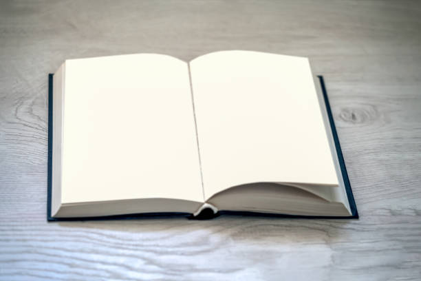 istock book with blank white pages on wooden table 1197086136