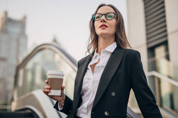 istock Young woman with coffee cup 1197086217
