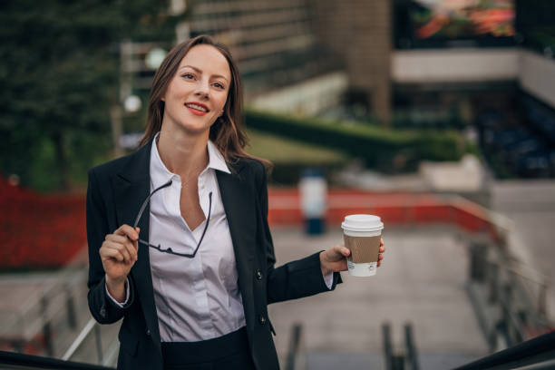 istock Young woman with coffee cup 1197086242