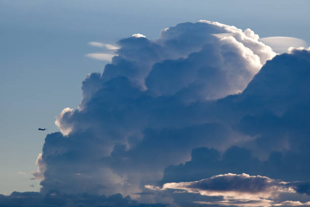 Airplane landing in front of a thunderstorm Airplane landing in front of a thunderstorm. Microburst stock pictures, royalty-free photos & images