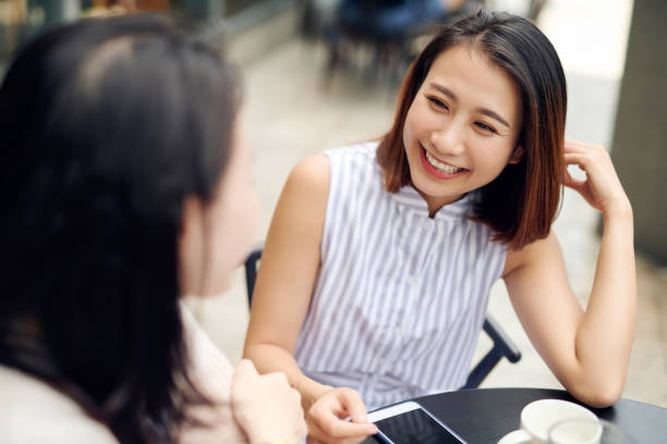 istock Women friends gossiping during coffee time. 1197087699