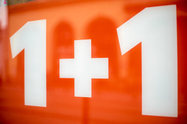 istock white headline 1 +1 on a red background when sold in a store 1197091031