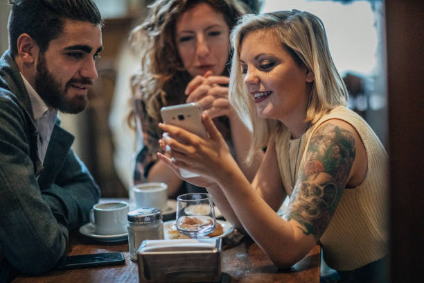 istock Friends sitting in coffee shop 1197091032