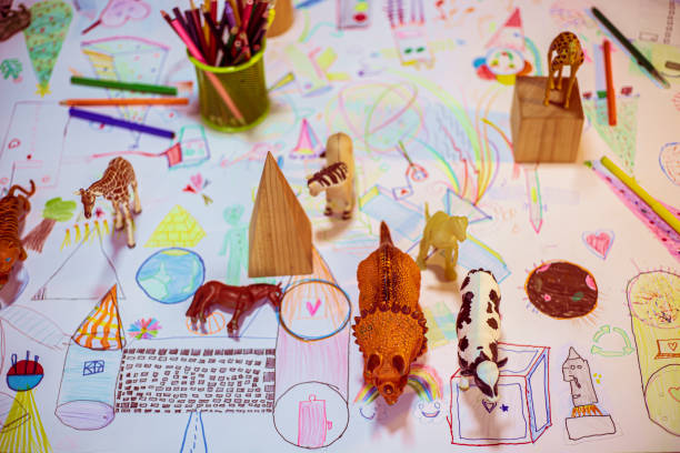 istock Composition of geometric figures and plastic toy animals 1197094537