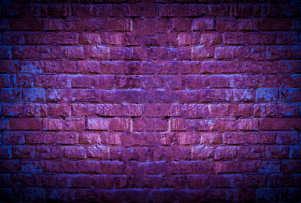 istock a neon brick wall glow with copy space mockup, grunge texture 1197095280