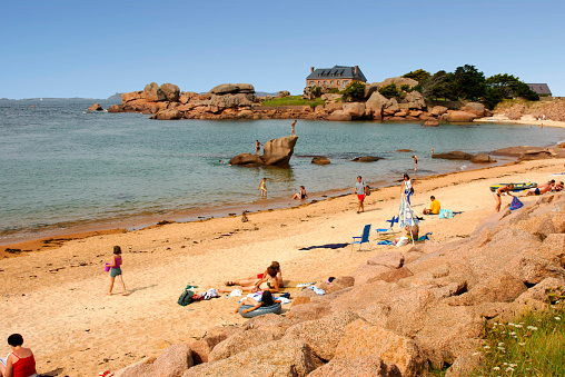 September 9th.2019. This is the beach with tourists and holidaymakers on a sunny afternoon at Tregastel. Trégastel (Breton: Tregastell) is a commune in the Côtes-d'Armor department of the region of Brittany in northwestern France.