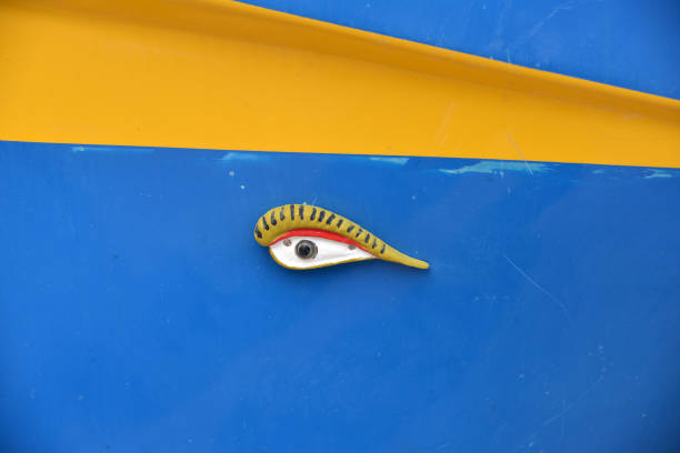 Marsaxlokk, Malta - 22 December, 2023: close-up view of a colourful Maltese fishing boat in the harbour of Marsaxlokk