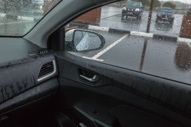istock rain in the car, raindrops fly through the open window 1197100413
