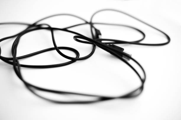 istock Tangled black wires on a white background 1197101910
