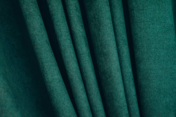 istock emerald luxury fabric background with copy space, drapery, selective focus, film and grain photo 1197101943