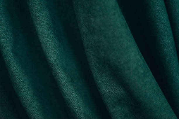 istock emerald luxury fabric background with copy space, drapery, selective focus, film and grain photo 1197101963